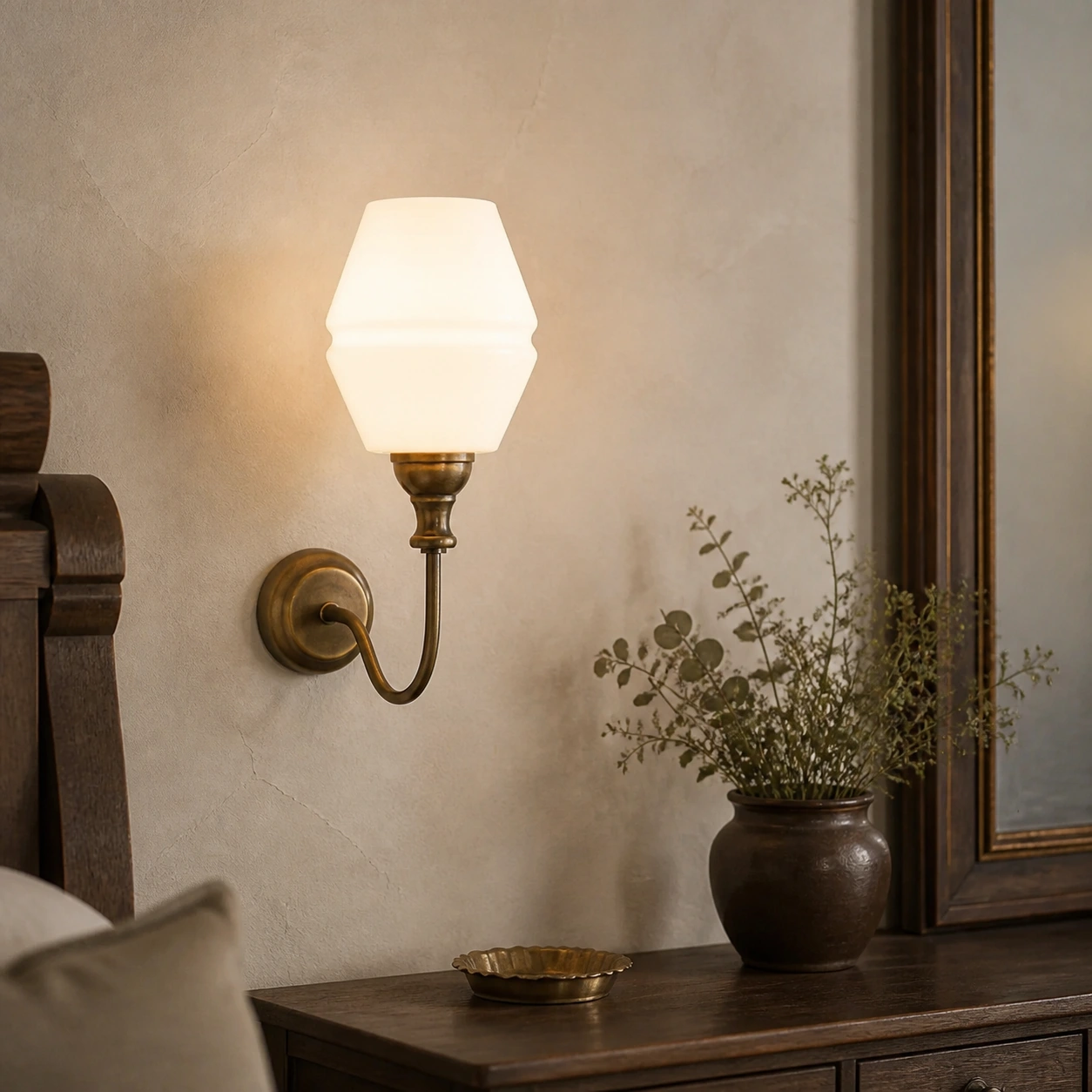 Vintage brass glass wall light in an interior scene