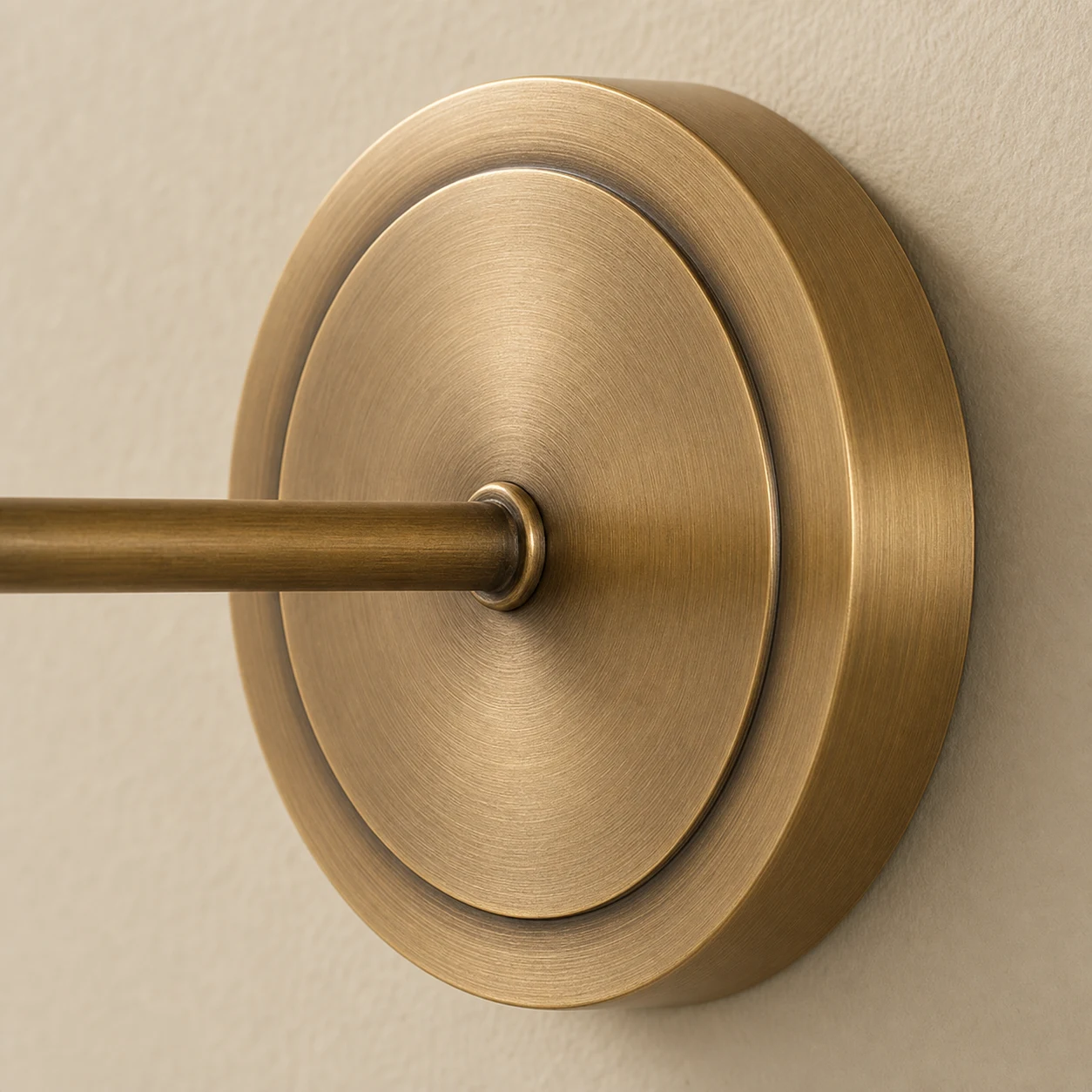Brushed brass round wall backplate close detail