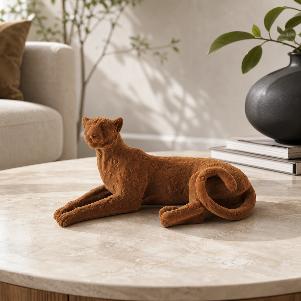 Brown lying leopard tabletop sculpture on a coffee table