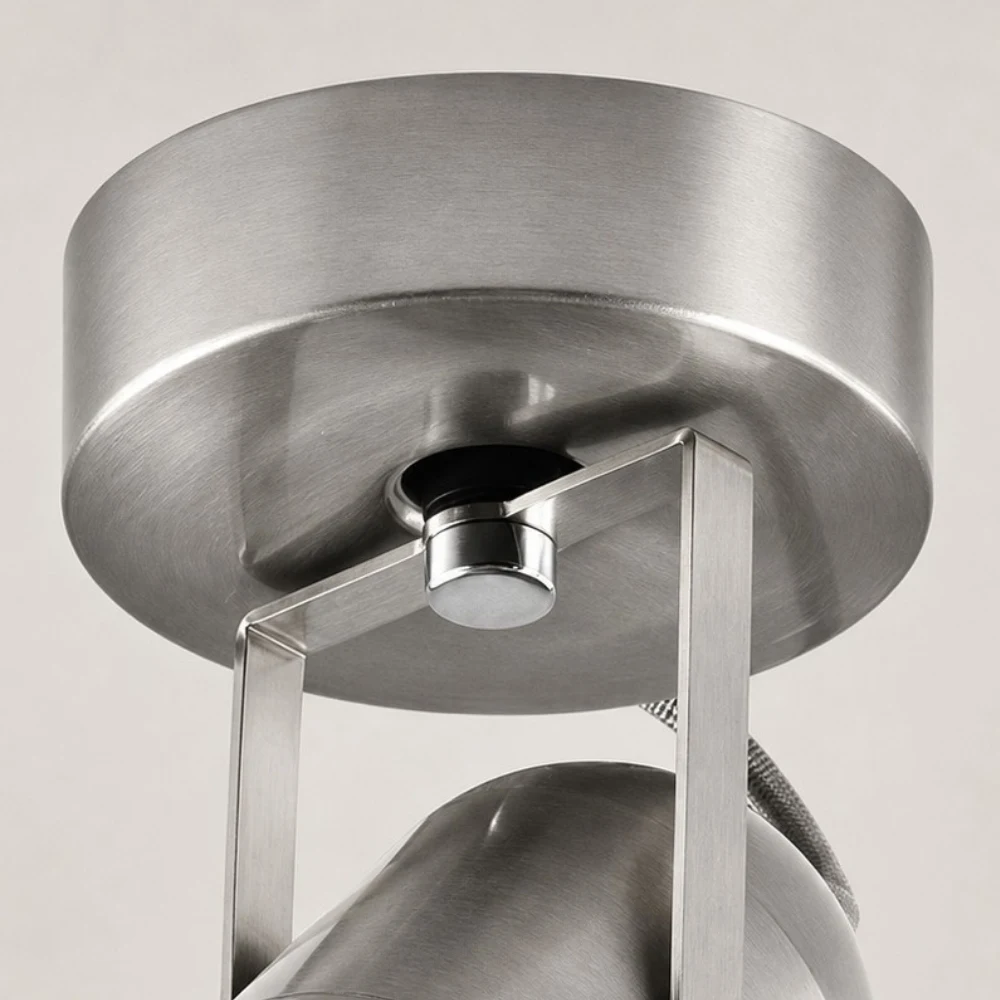 Close view of the round metal mounting base and bracket