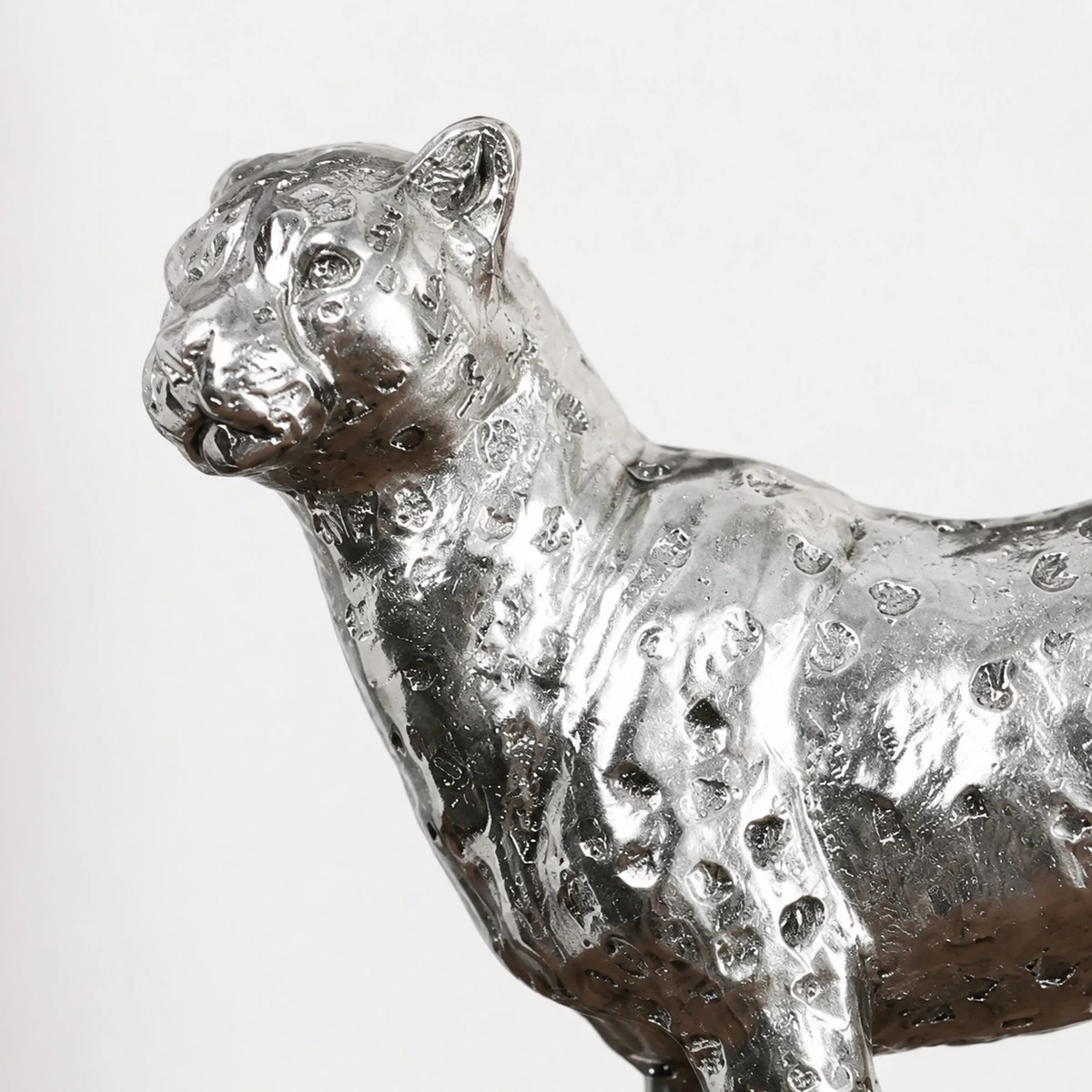 Close-up of silver leopard sculpture texture