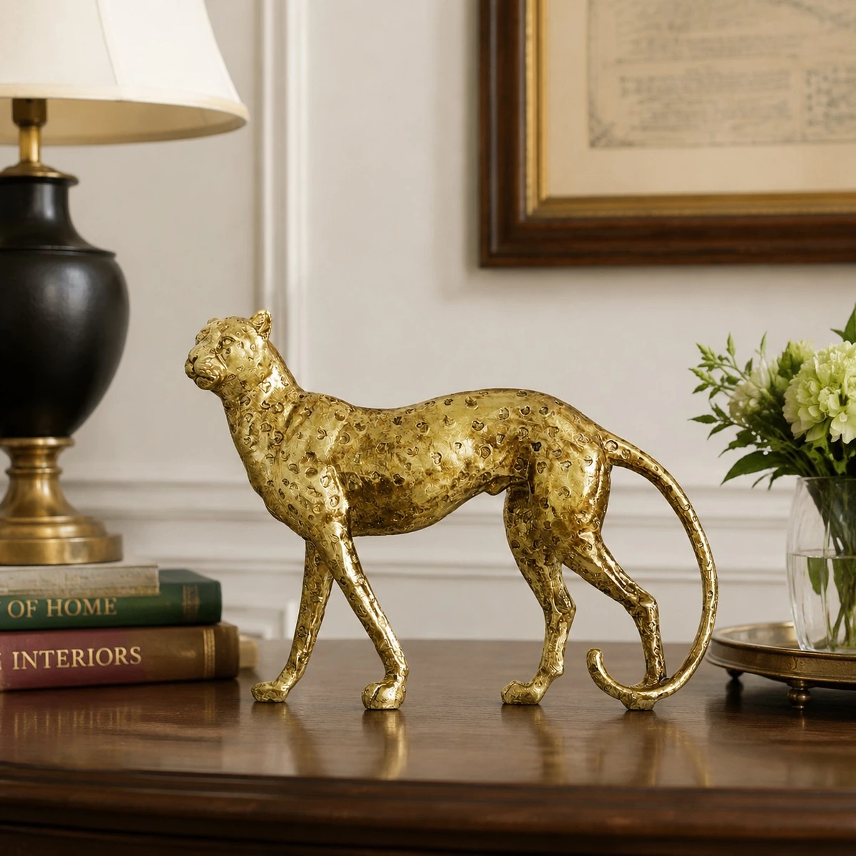 Gold standing leopard sculpture in a styled room