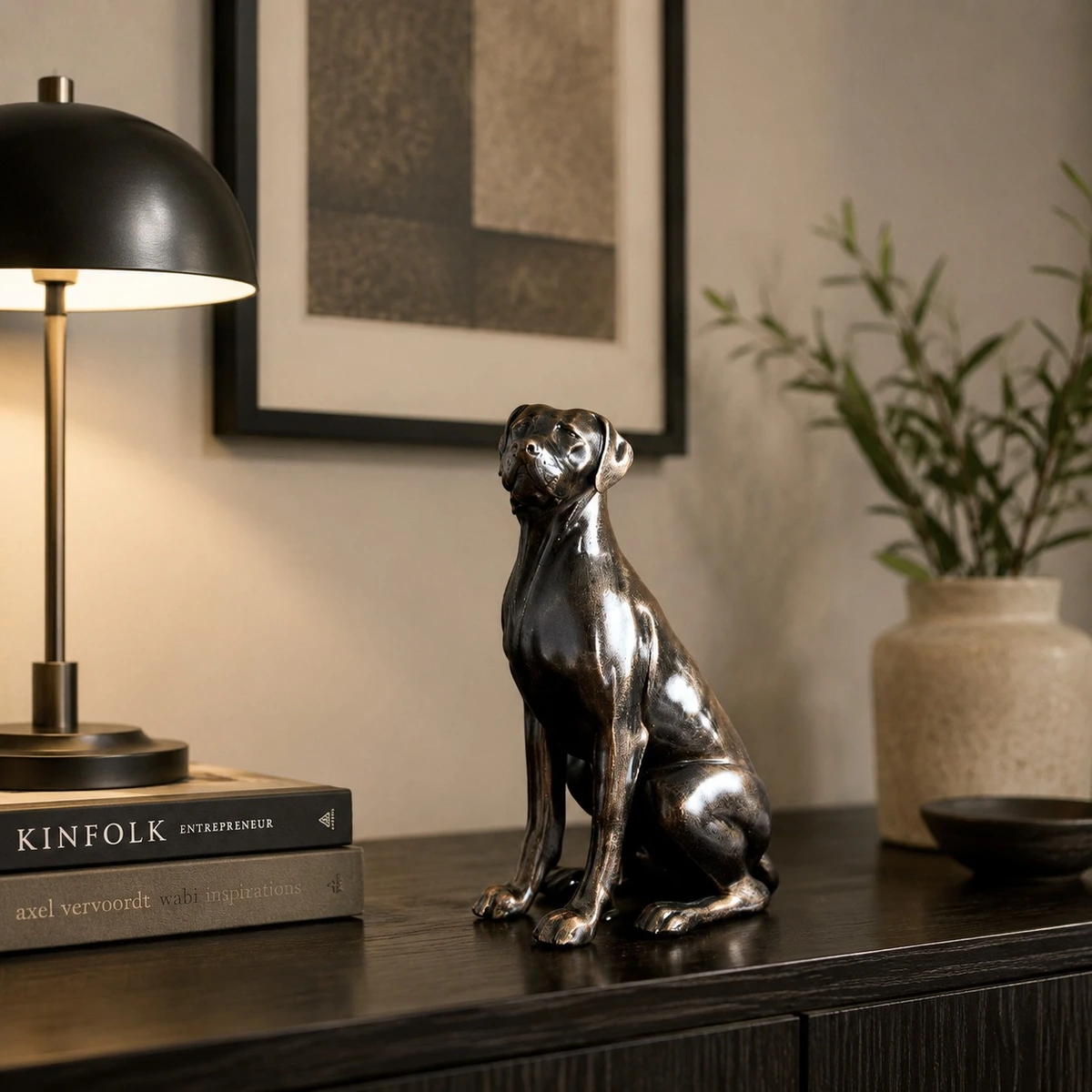 Black dog sculpture near a table lamp