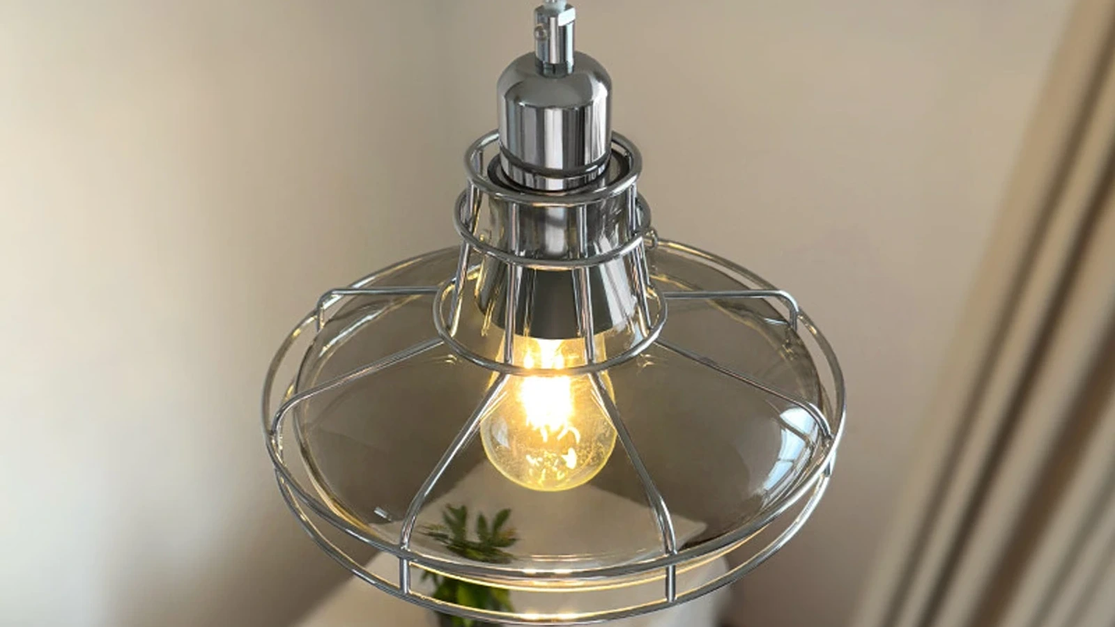 Chrome grey glass pendant light shown as a wide interior banner