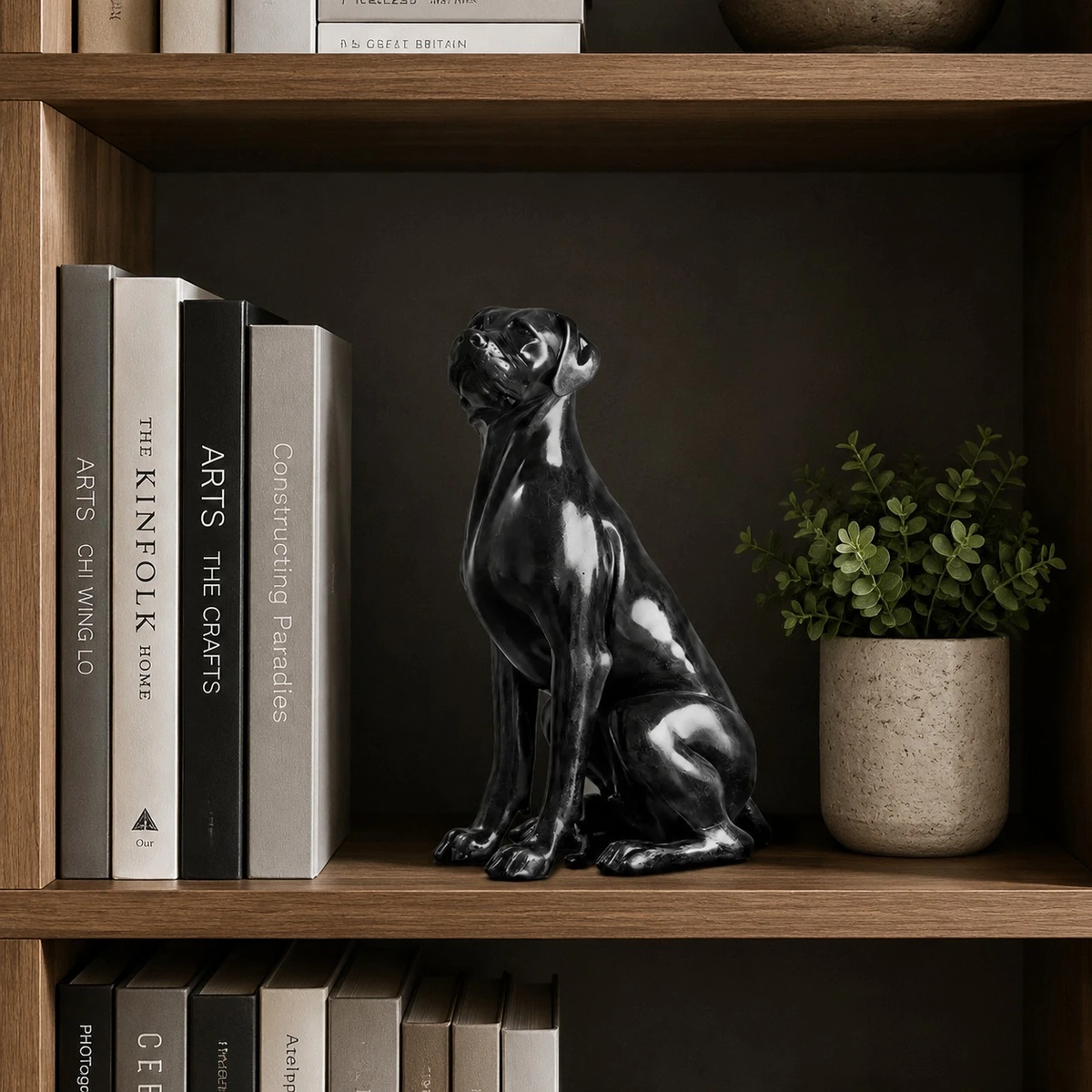 Black dog sculpture on a bookshelf